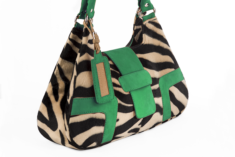 Handcrafted women's luxurious elegant handbag in animal print and emerald green. Perfect for elevated everyday style.   
                Choose from our luxurious collections of leather and fabric to perfectly match your handbags to your outfits.